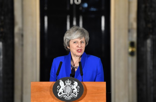 UK PM May narrowly survives no-confidence vote after Brexit defeat; reaches out to rivals