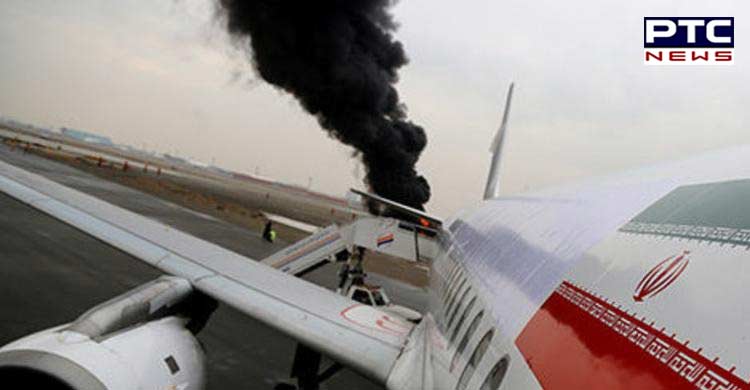 Aeroplane with 100 people on board catches fire in Tehran