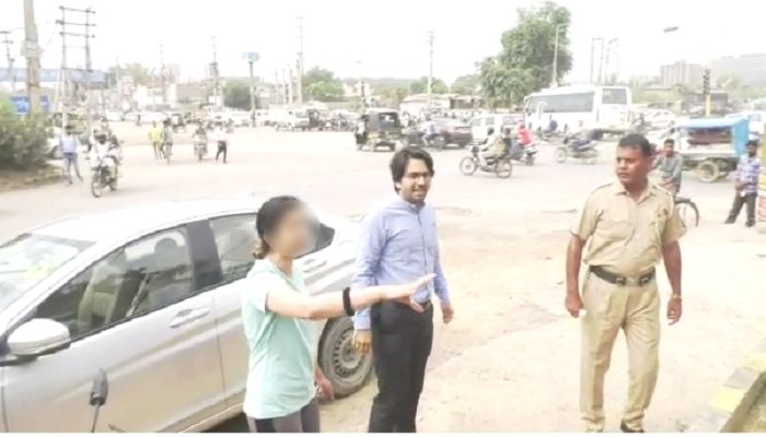 कार चालक पति-पत्नी की दबंगई, सिग्नल तोड़ने पर रोका तो पुलिसकर्मी पर चढ़ा दी कार