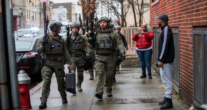 Police officer among six killed in New Jersey shooting Police officer among six killed in New Jersey shooting