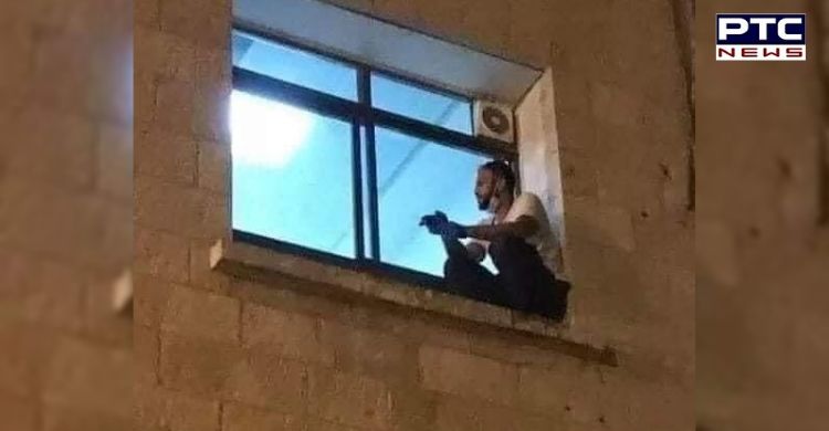 Palestinian man bids final goodbye to his mother through a hospital window