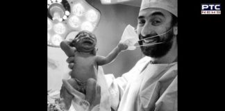 Photo of the year: Newborn baby pulls doctor’s mask
