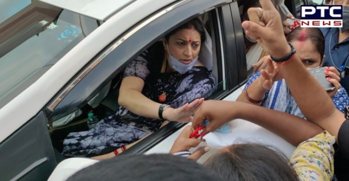 Congress workers gherao Smriti Irani in Varanasi after remark on Hathras rape case Congress workers gherao Smriti Irani in Varanasi after remark on Hathras rape case