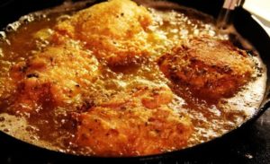 Woman Puts Her Hand in Hot Oil to Fry Food