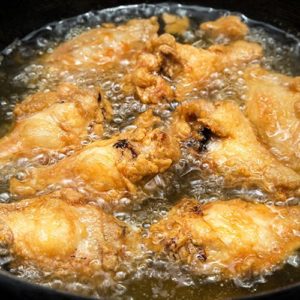 Woman Puts Her Hand in Hot Oil to Fry Food