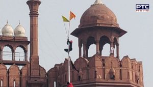 Farmers Tractor Parade : Farmers hoist the flag at the Red Fort Delhi