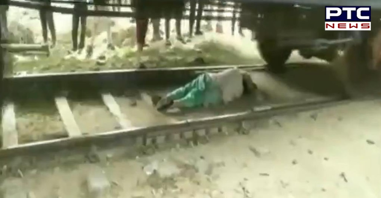 Watch: Haryana woman lies on railway track to escape being run over