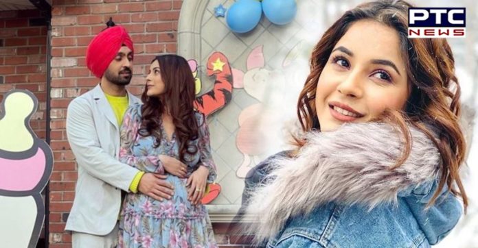 Shehnaaz Gill flaunts baby bump in a picture with Diljit Dosanjh from sets of Honsla Rakh Shehnaaz Gill flaunts baby bump in a picture with Diljit Dosanjh from sets of Honsla Rakh