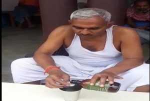 BJP MLA Surendra Singh gives a demonstration of drinking cow urine to keep away COVID-19