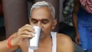 BJP MLA Surendra Singh gives a demonstration of drinking cow urine to keep away COVID-19