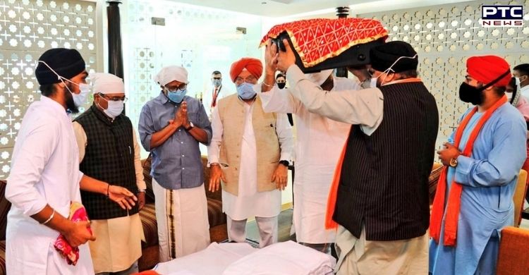Delhi: Hardeep Singh Puri receives Sri Guru Granth Sahib, brought from Kabul