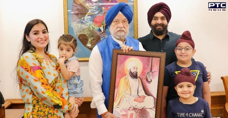 Harkirat Kaur Kukreja presents a portrait of Guru Tegh Bahadur to Hardeep Singh Puri