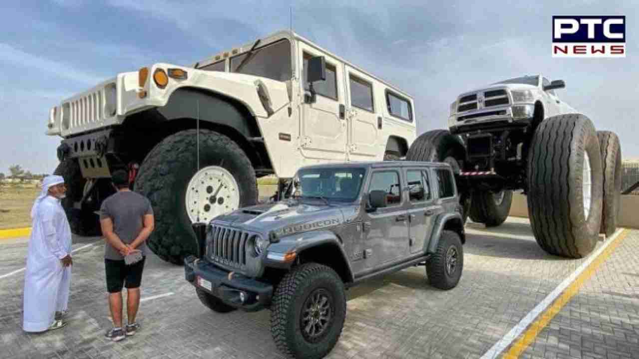 Sheikh Hamad bin Hamdan Al Nahyan showing off his huge vehicles with another person